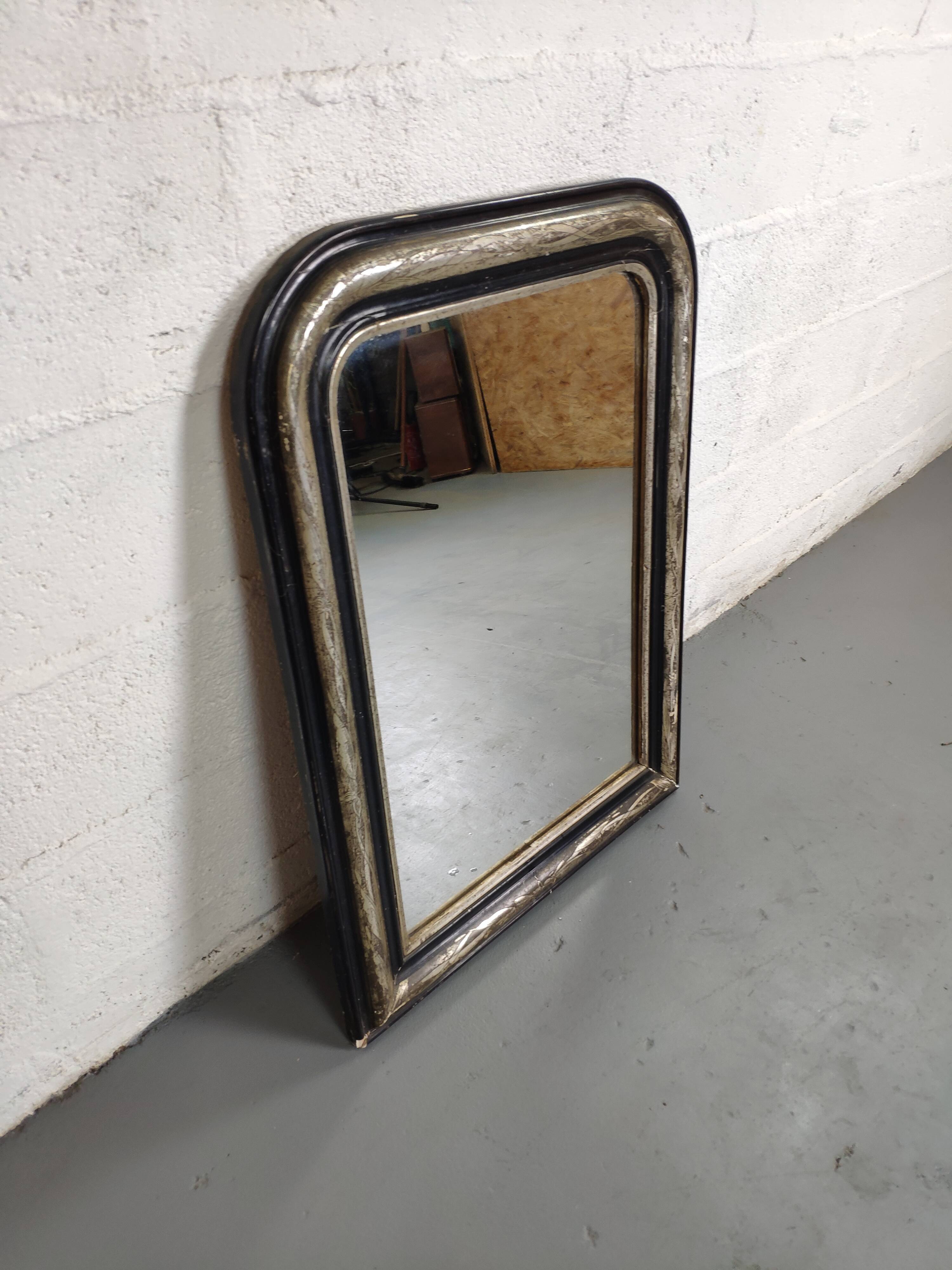 Mirror Louis-Philippe black wood and silver carved
