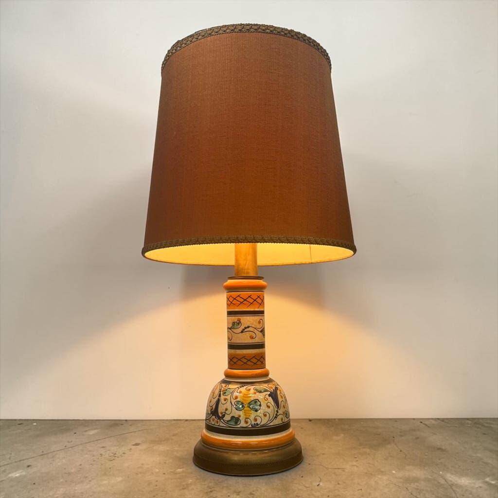 Vintage orange Portuguese table lamp with a ceramic base.