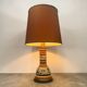 Vintage orange Portuguese table lamp with a ceramic base.