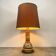 Vintage orange Portuguese table lamp with a ceramic base.