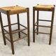 Pair of 80 cm high straw and beech bar stools