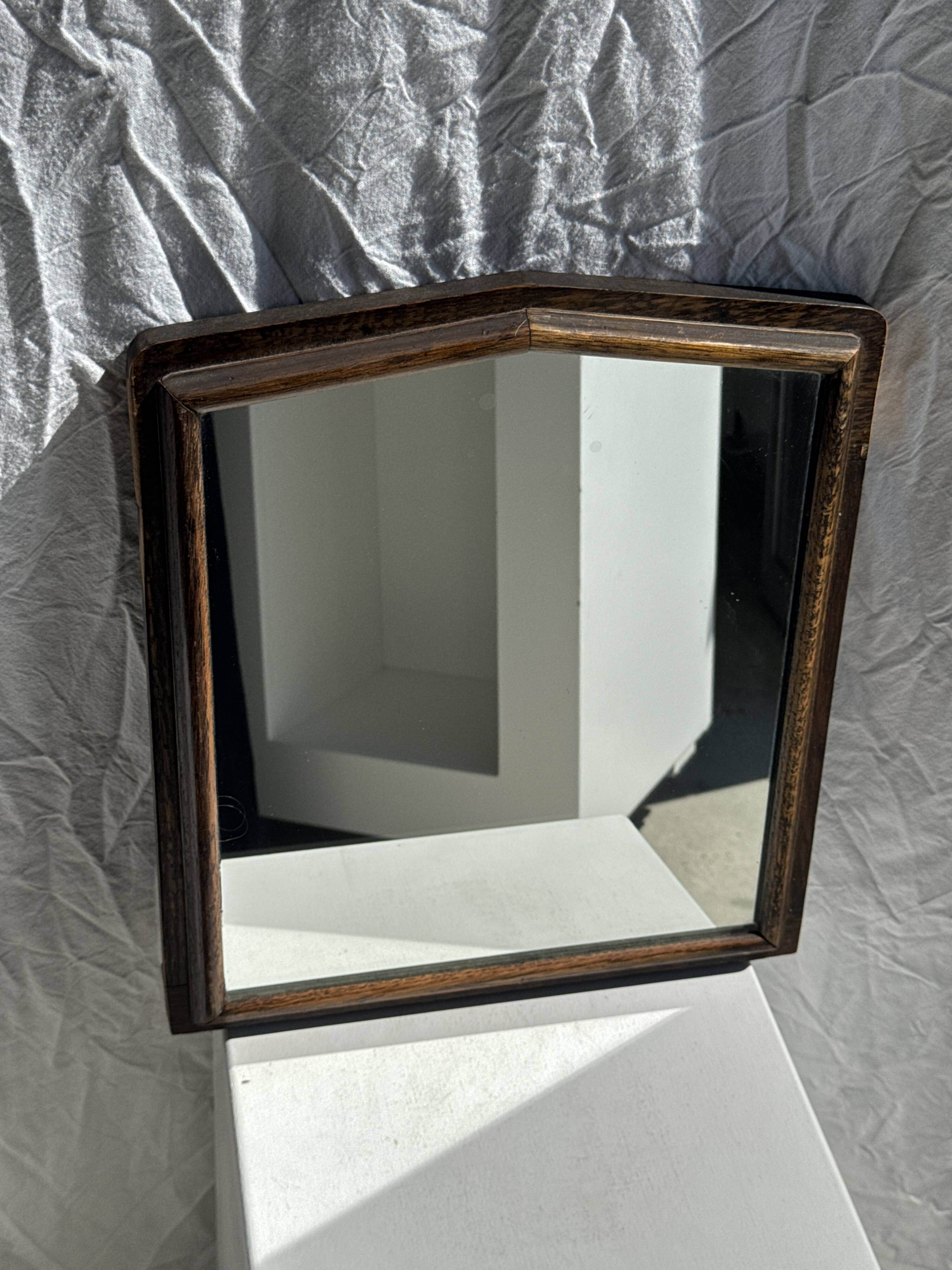 Small antique English rectangular mirror with pediment and oak frame