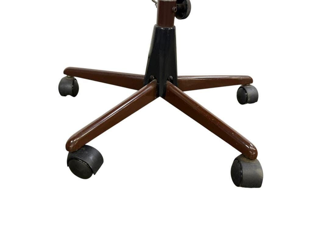 Brown vintage office chair from the 70s on wheels.
