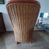 Armchair in woven rattan and exotic wood