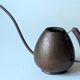 Old copper watering can with wooden handle, complete usuable, vintage from the 1960s