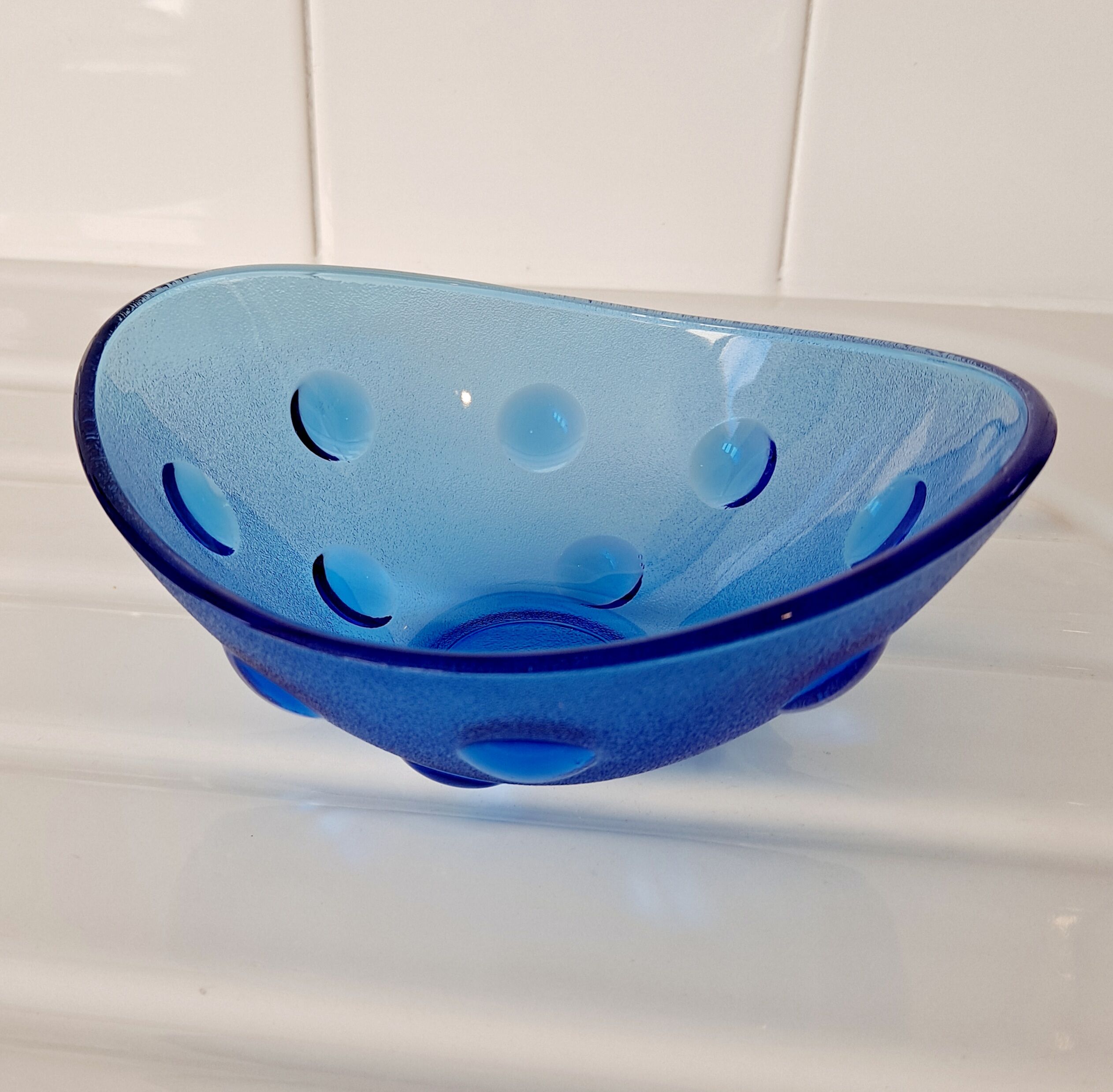 Empty cup blue glass pocket