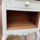 Renovated bedside tables in laurel green and light wood.