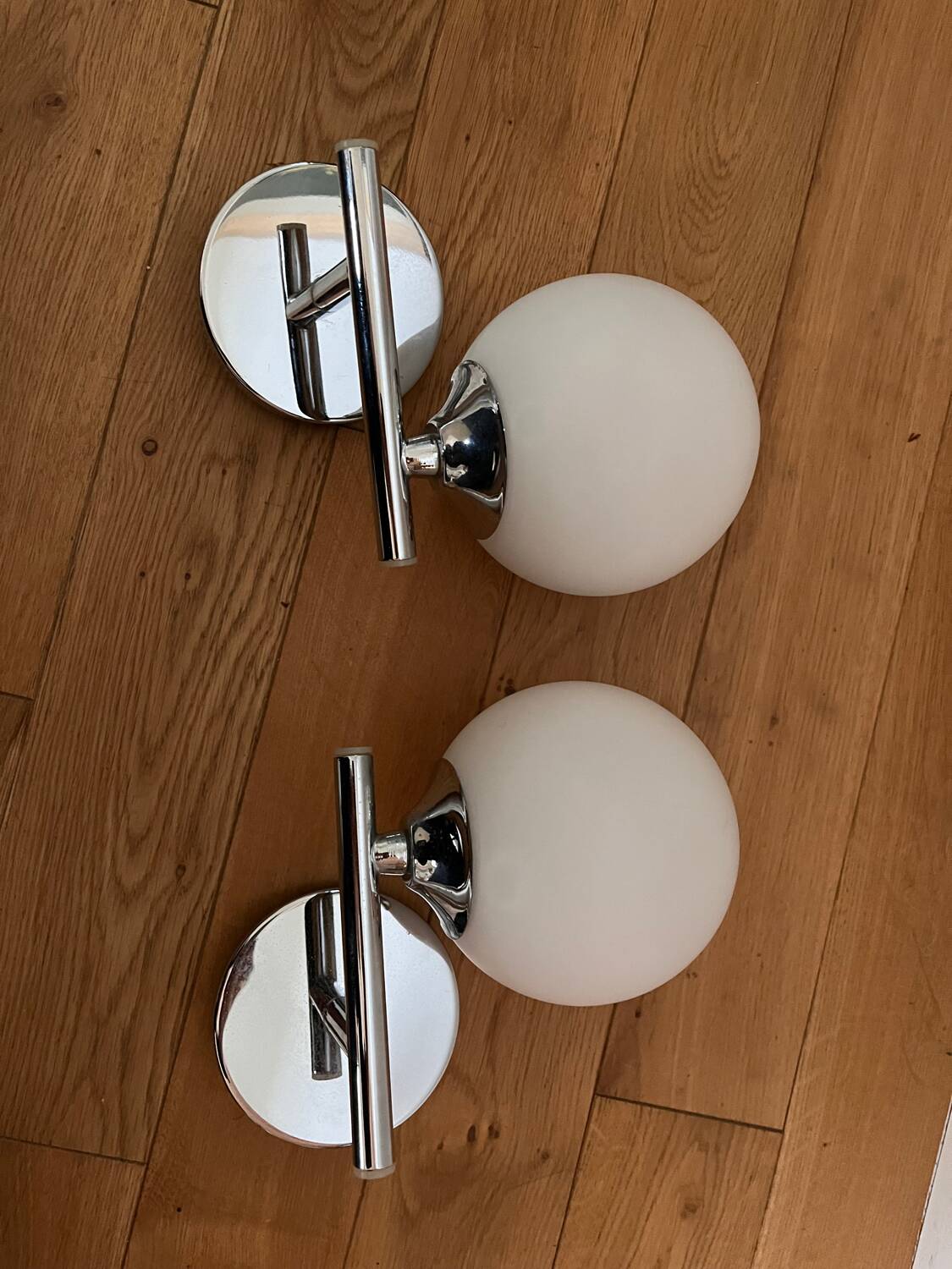 Pair of metal and opaline wall lights