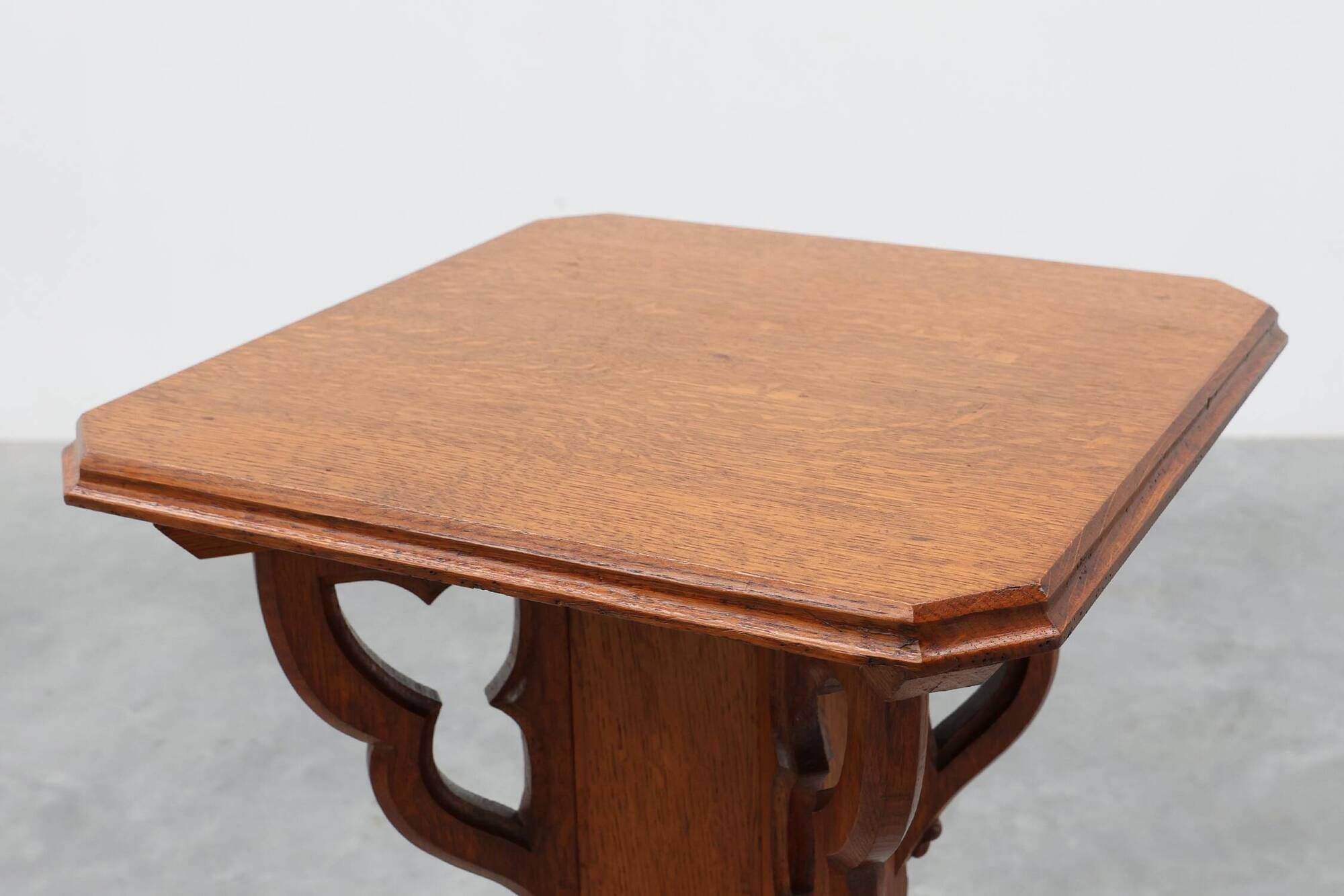 Art Deco oak pedestal with pierced brackets and cross base, Belgium 1920s