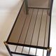 Magazine holder coffee table 1960s smoked glass, metal and brass Width 94.2 cm