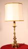bronze candlestick from the 18th century converted into a lamp with its shade