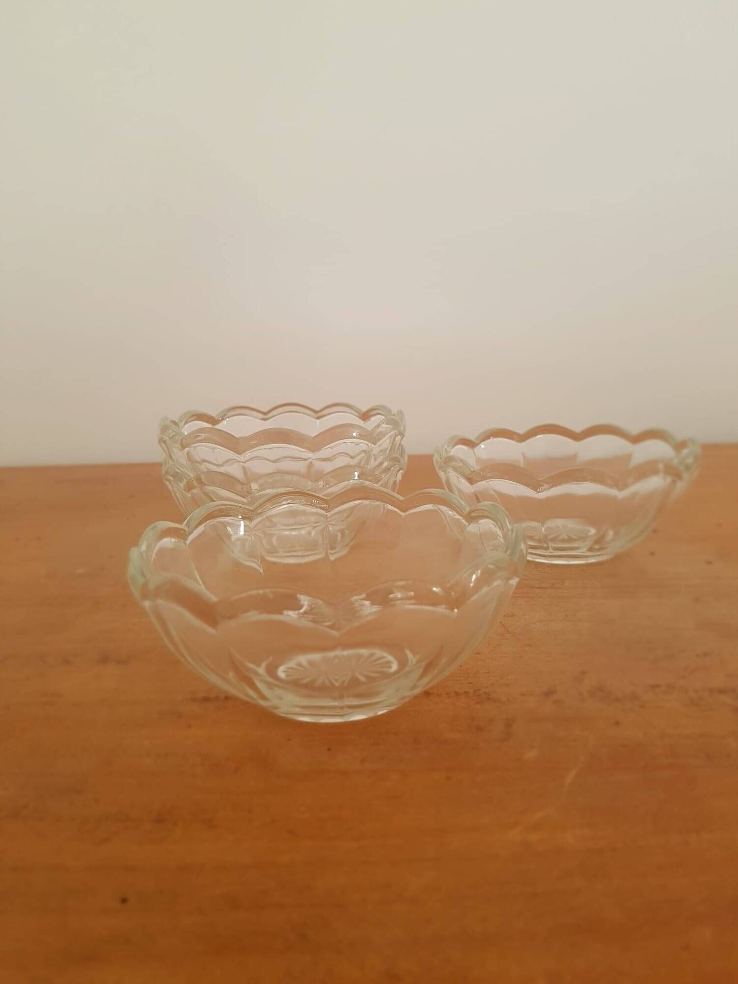 Set of 12 vintage scalloped glass dessert bowls.