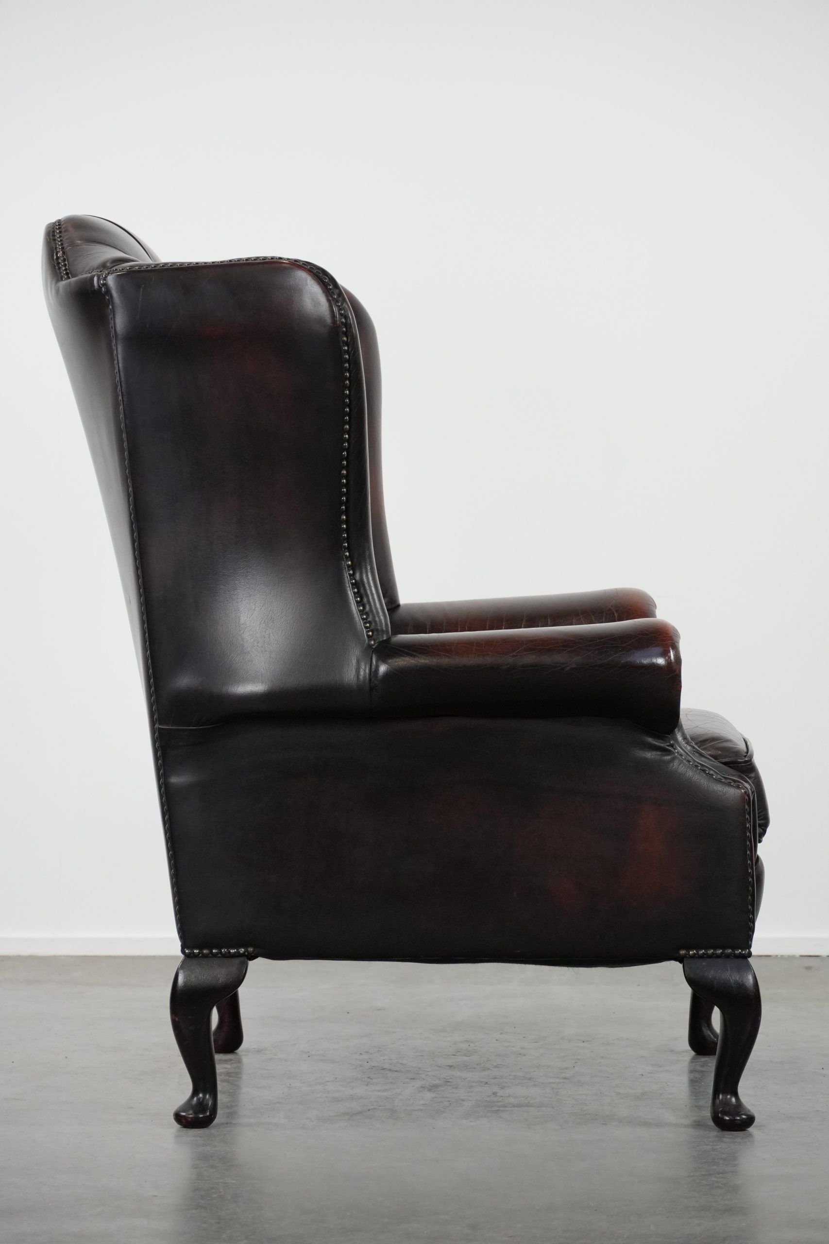 Cowhide leather Chesterfield wingback armchair in classic English style
