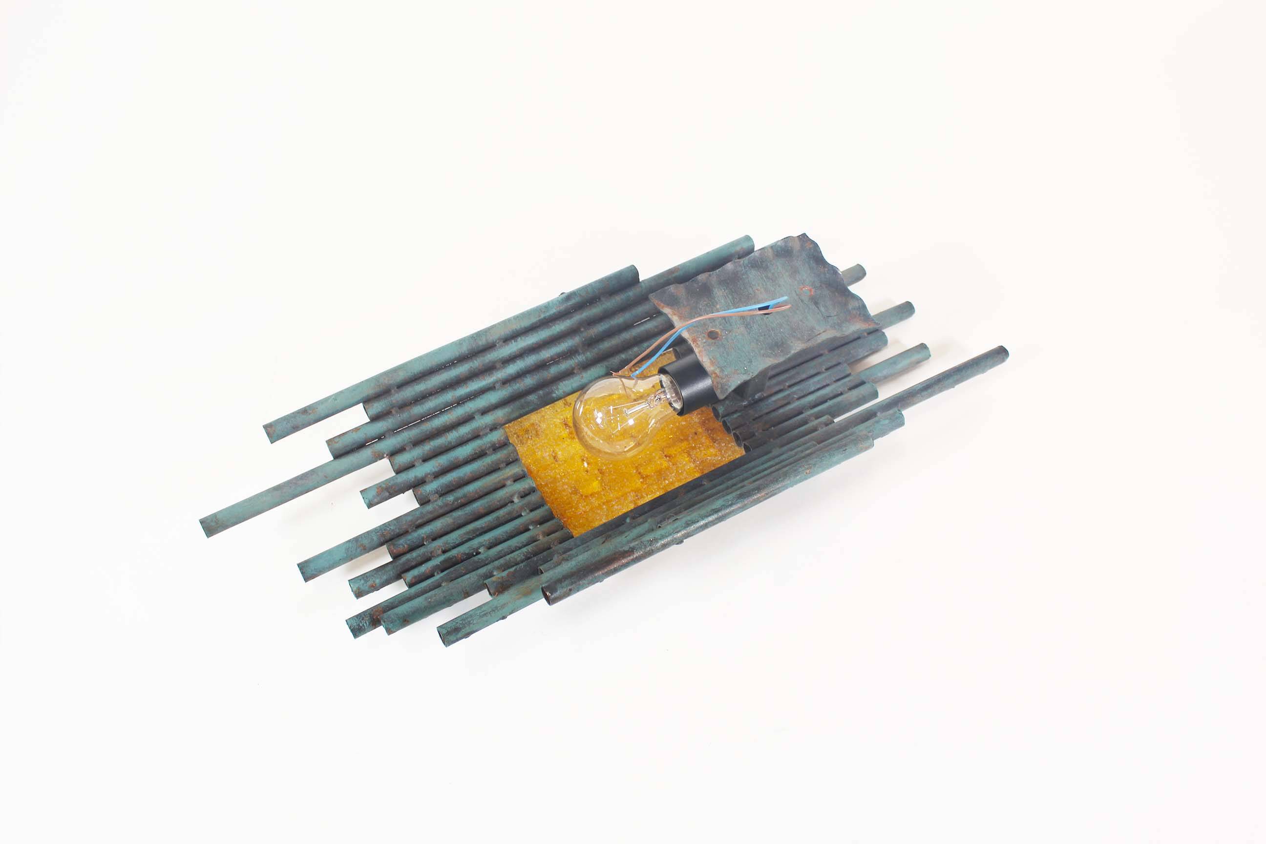 brutalist rough iron and glass wall sconce by Marcello Fantoni