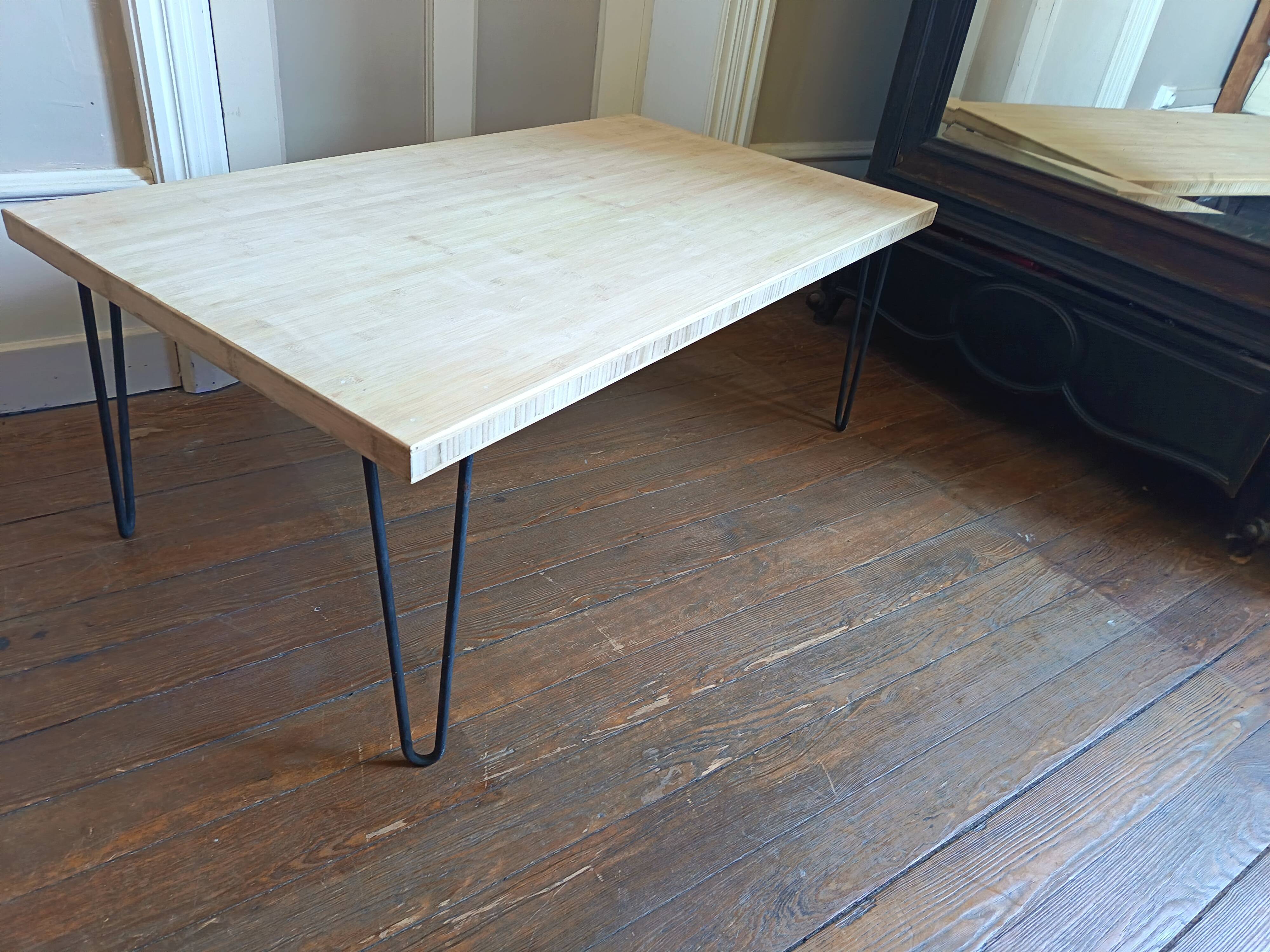 Coffee table in solid bamboo with steel legs.