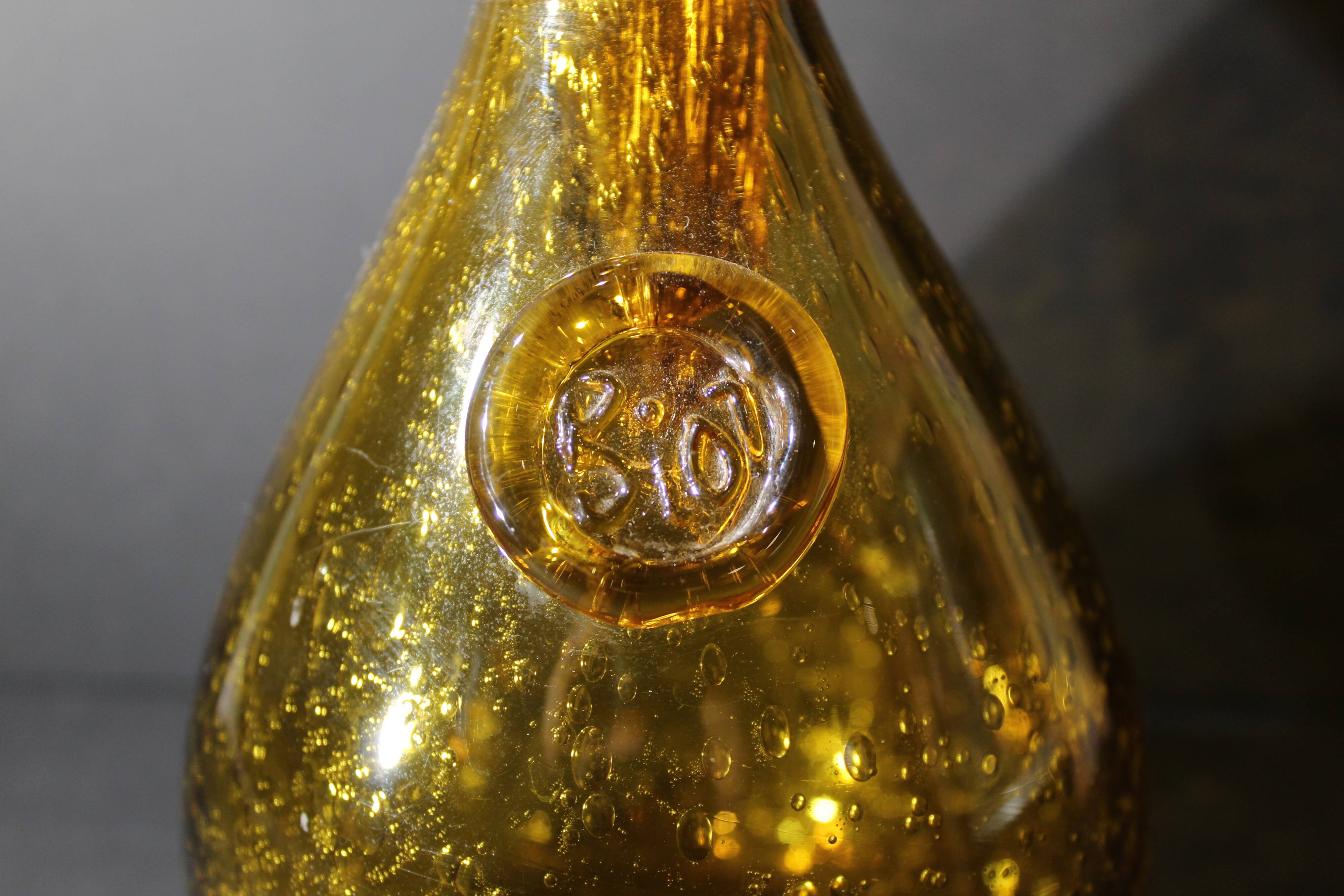 BIOT orange bubbled glass hourglass carafe