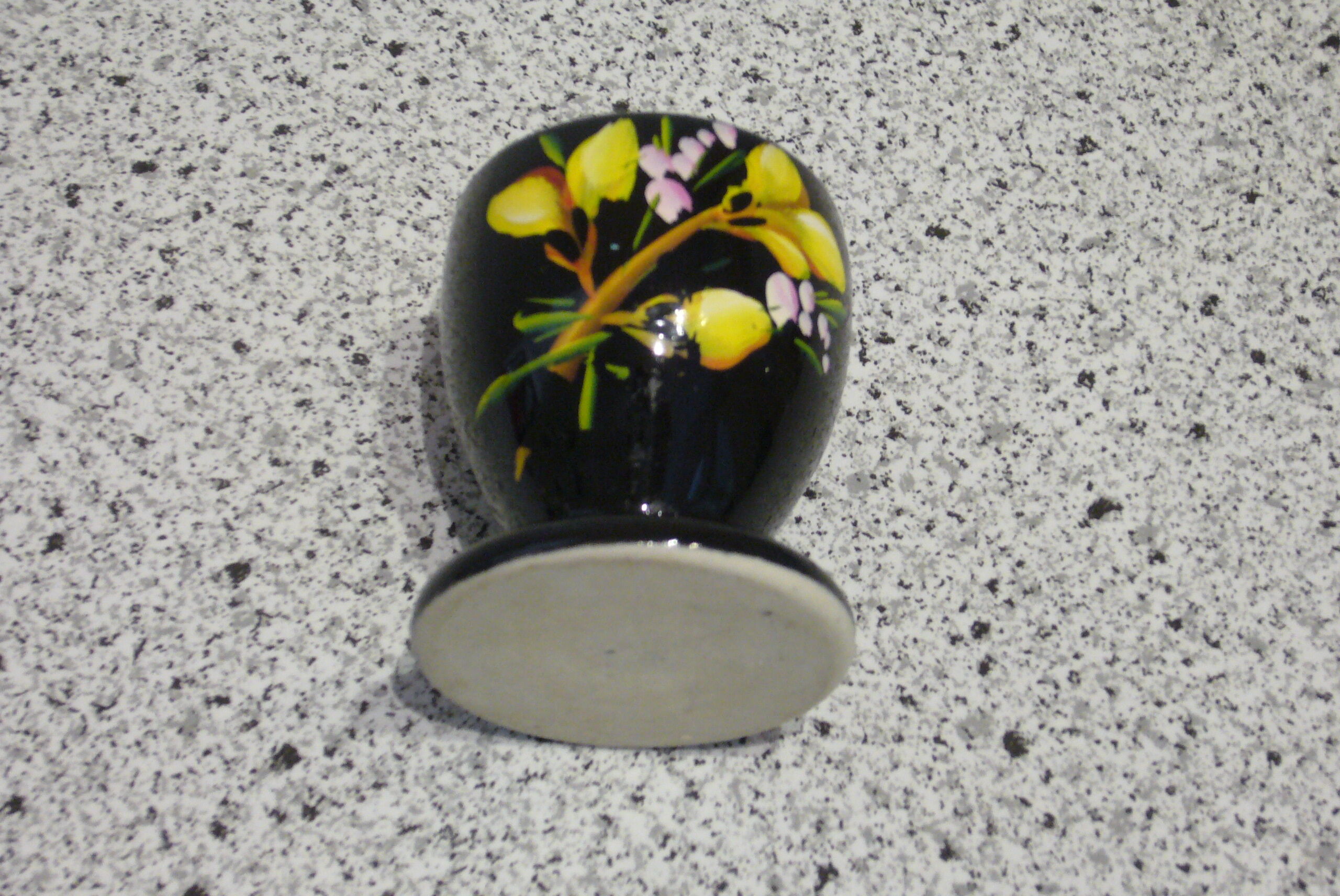 Black egg cup with hand-painted floral decoration