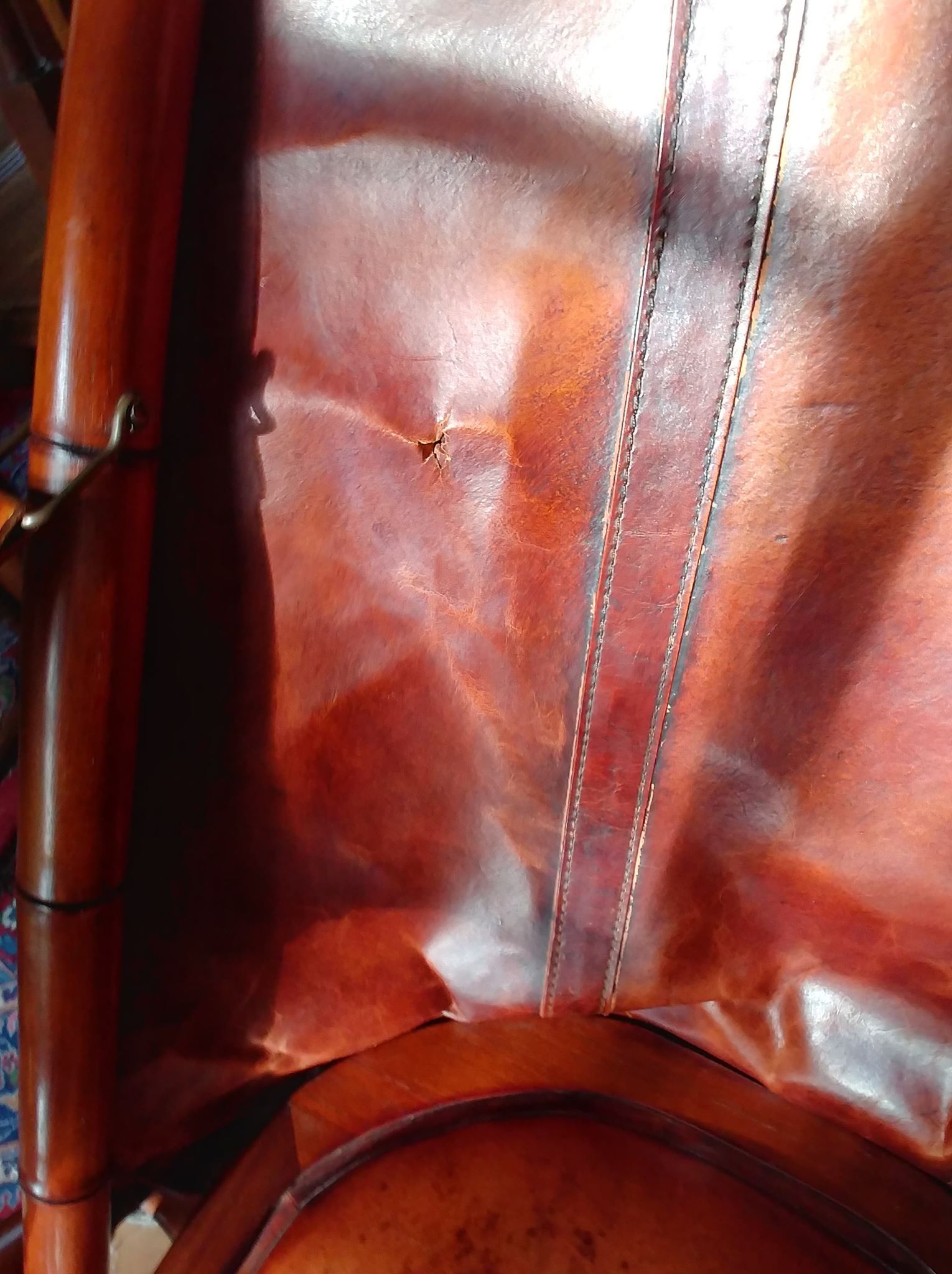 Leather folding armchair and footwork