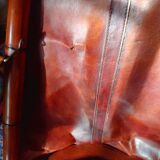 Leather folding armchair and footwork