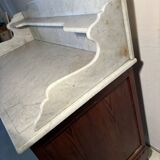 Antique wood and marble kitchen sideboard with carved backsplash