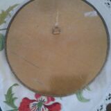 Round mirror bordered with copper