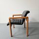 Pair of vintage Flototto armchairs in leather and wood, 1980s.