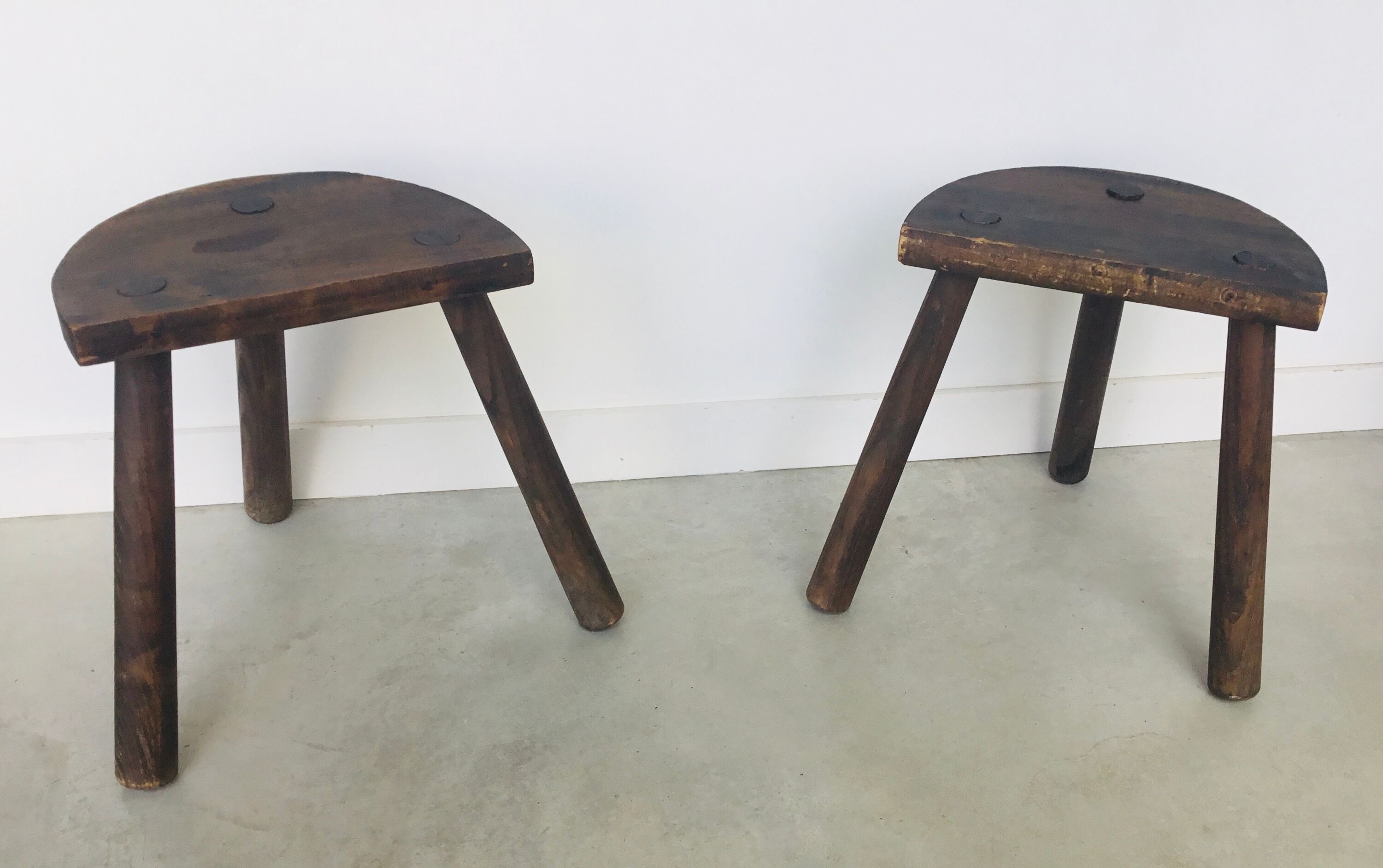 Pair of vintage tripod farm stools