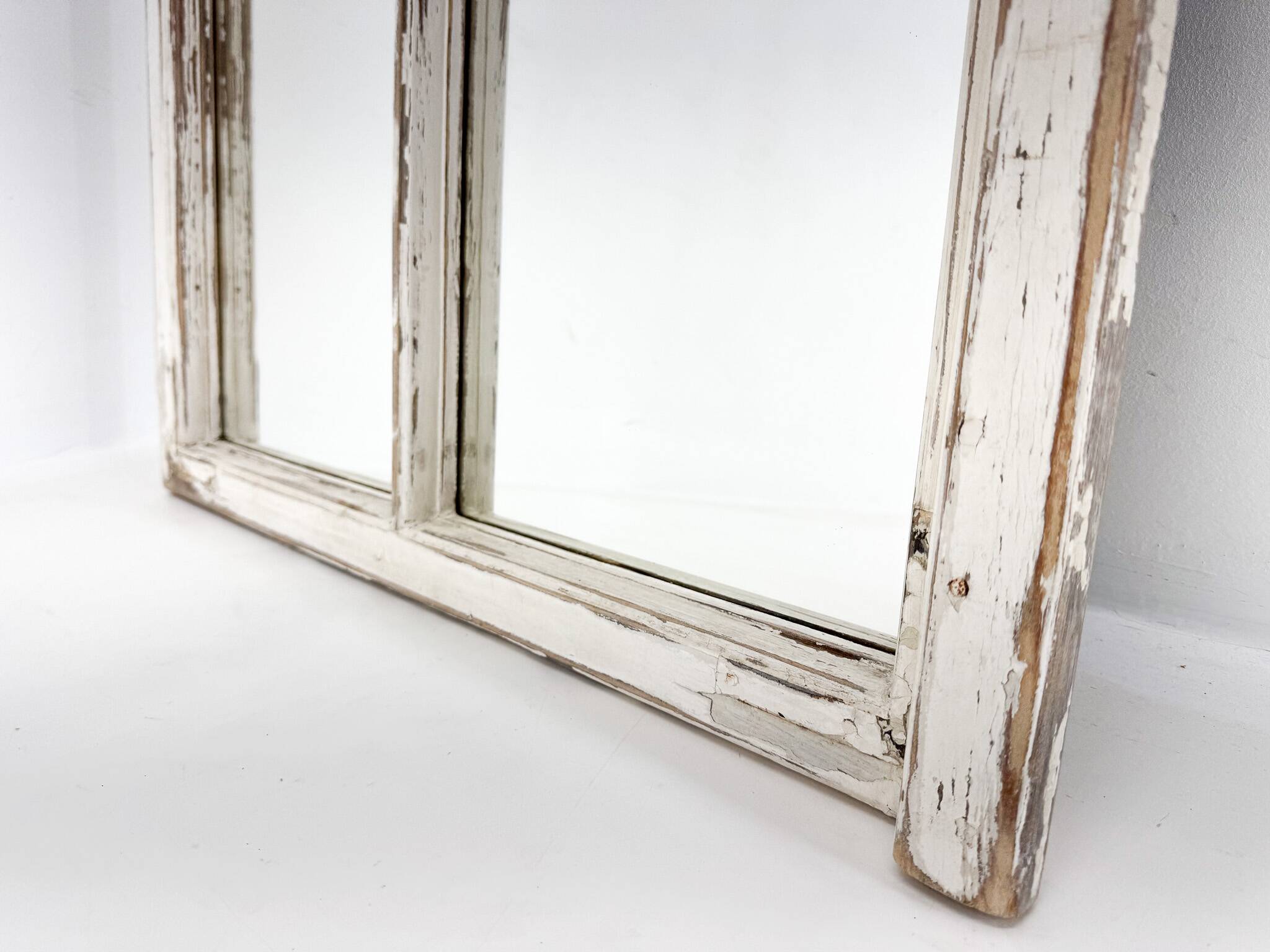 Vintage wooden window converted to a mirror
