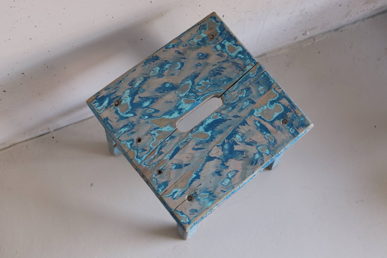 Blue patinated farm stool