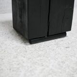 Brutalist chair, black-stained raw wood, steel. Work from the 1970s