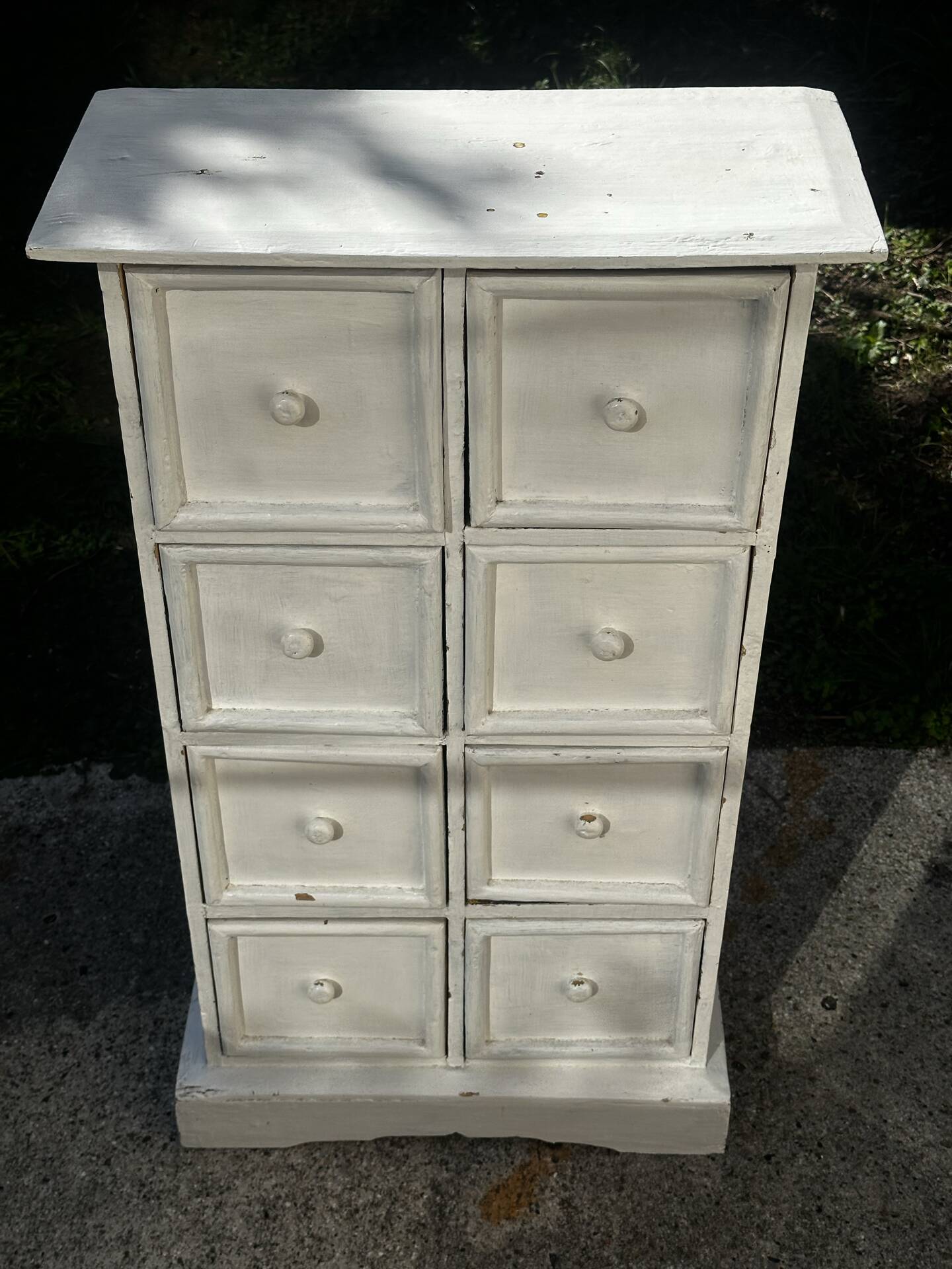 Small antique workshop cabinet with 8 painted wooden drawers.