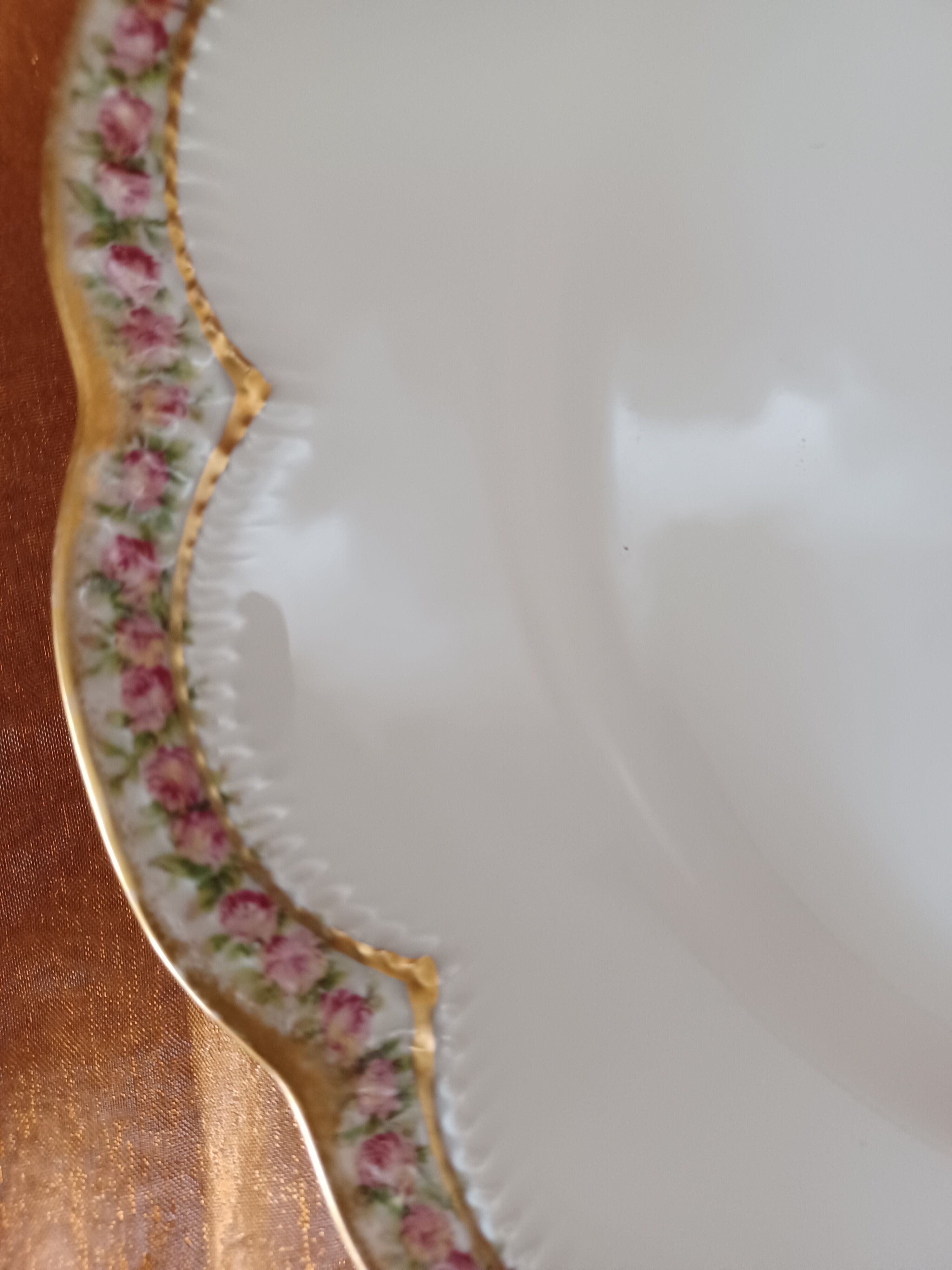 Haviland porcelain plate, contour decorations in floral garland.