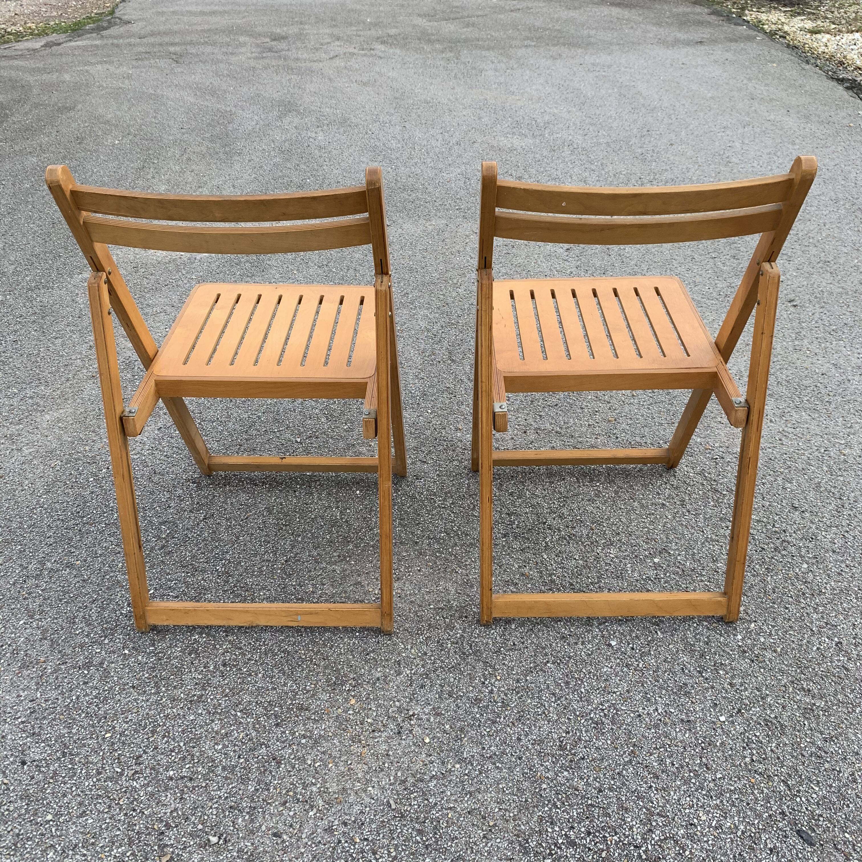 Pair of folding wooden chairs