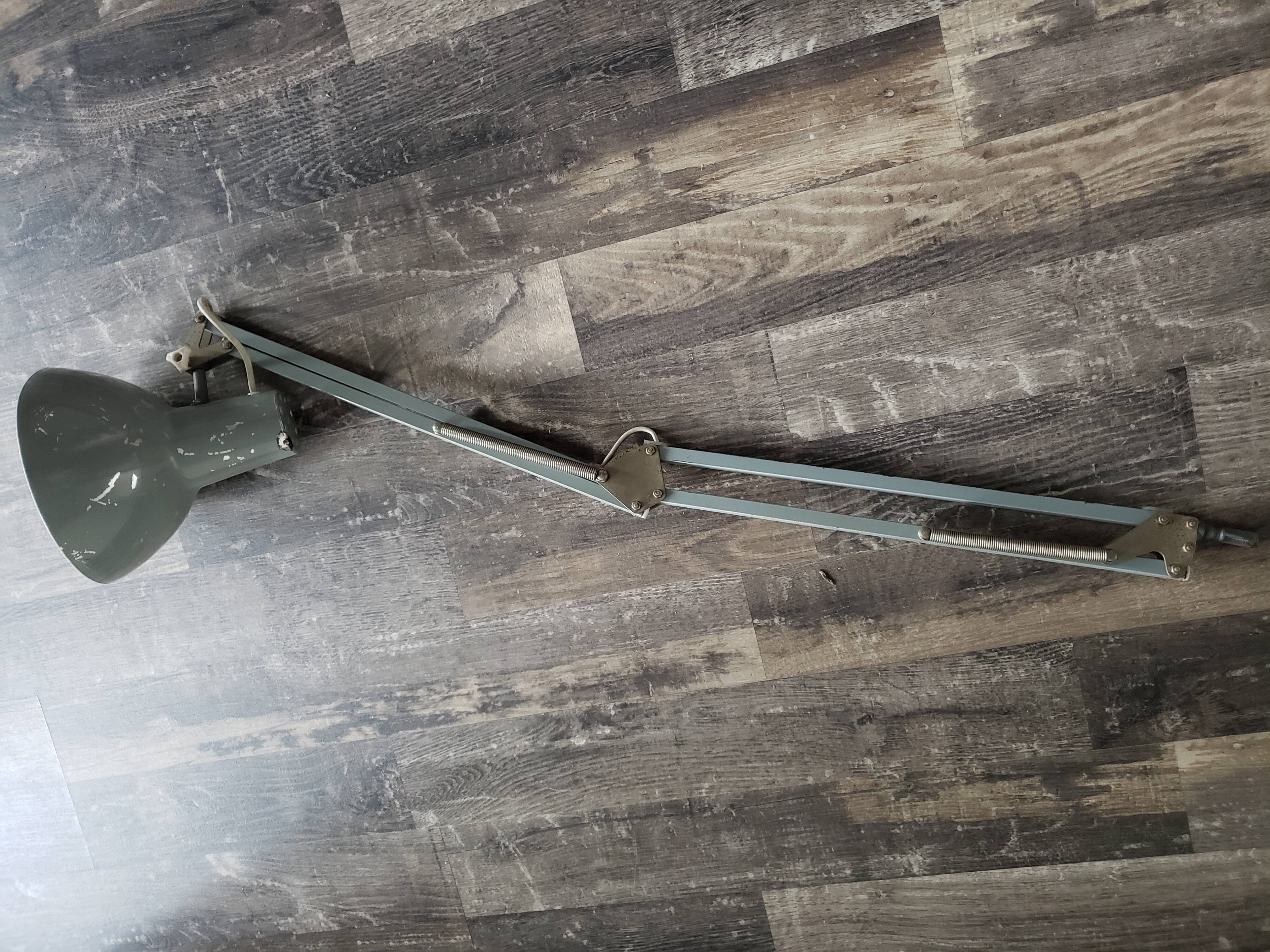 Grey articulated architect lamp to be restored