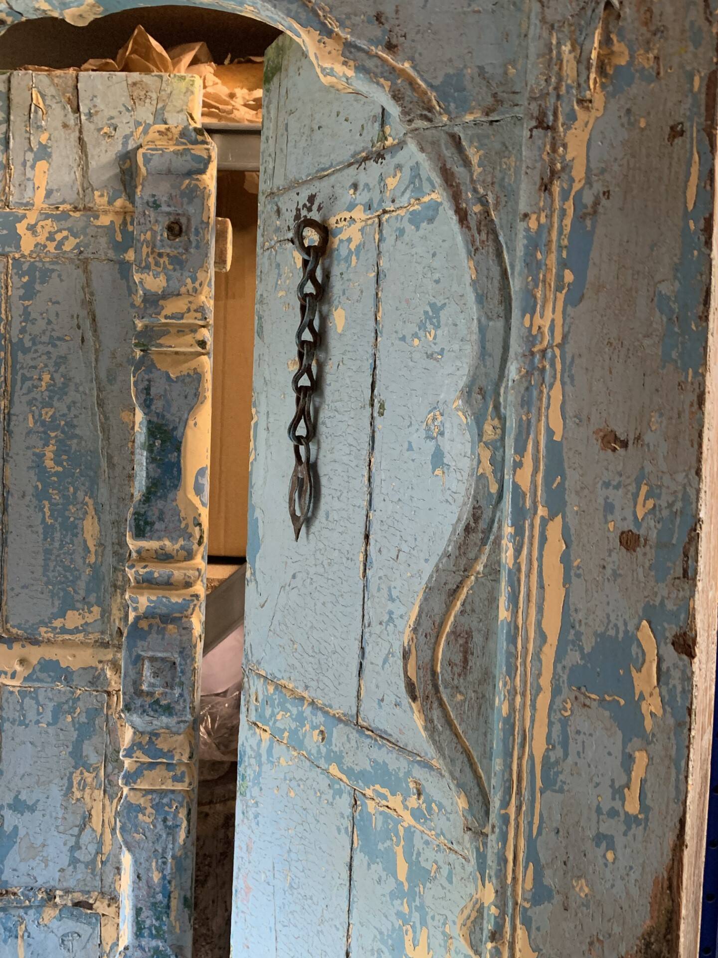 Blue patinated indian door with carved frame