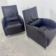 Pair of aubergine leather club armchairs by Cinna.