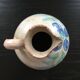 Antique pitcher with floral decoration
