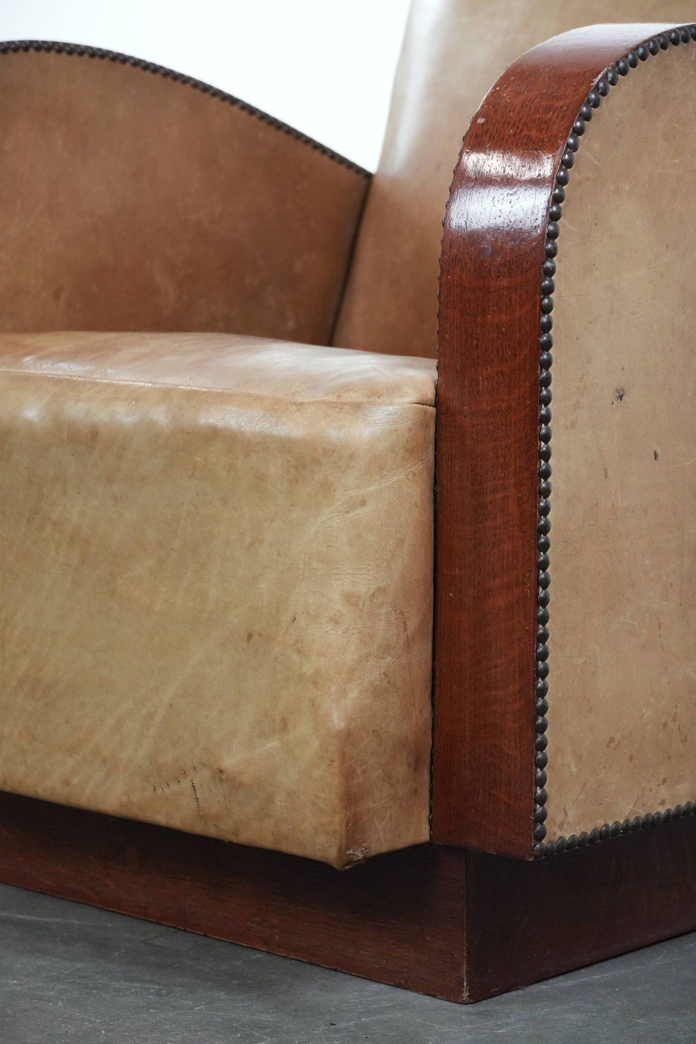 Art Deco design armchair in light cognac cowhide leather.