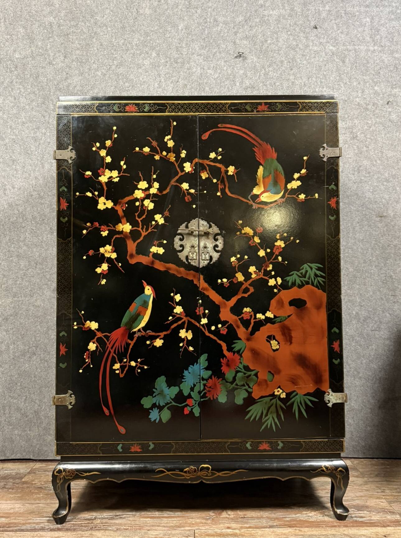 Chinese cabinet in black lacquer and colored decorations