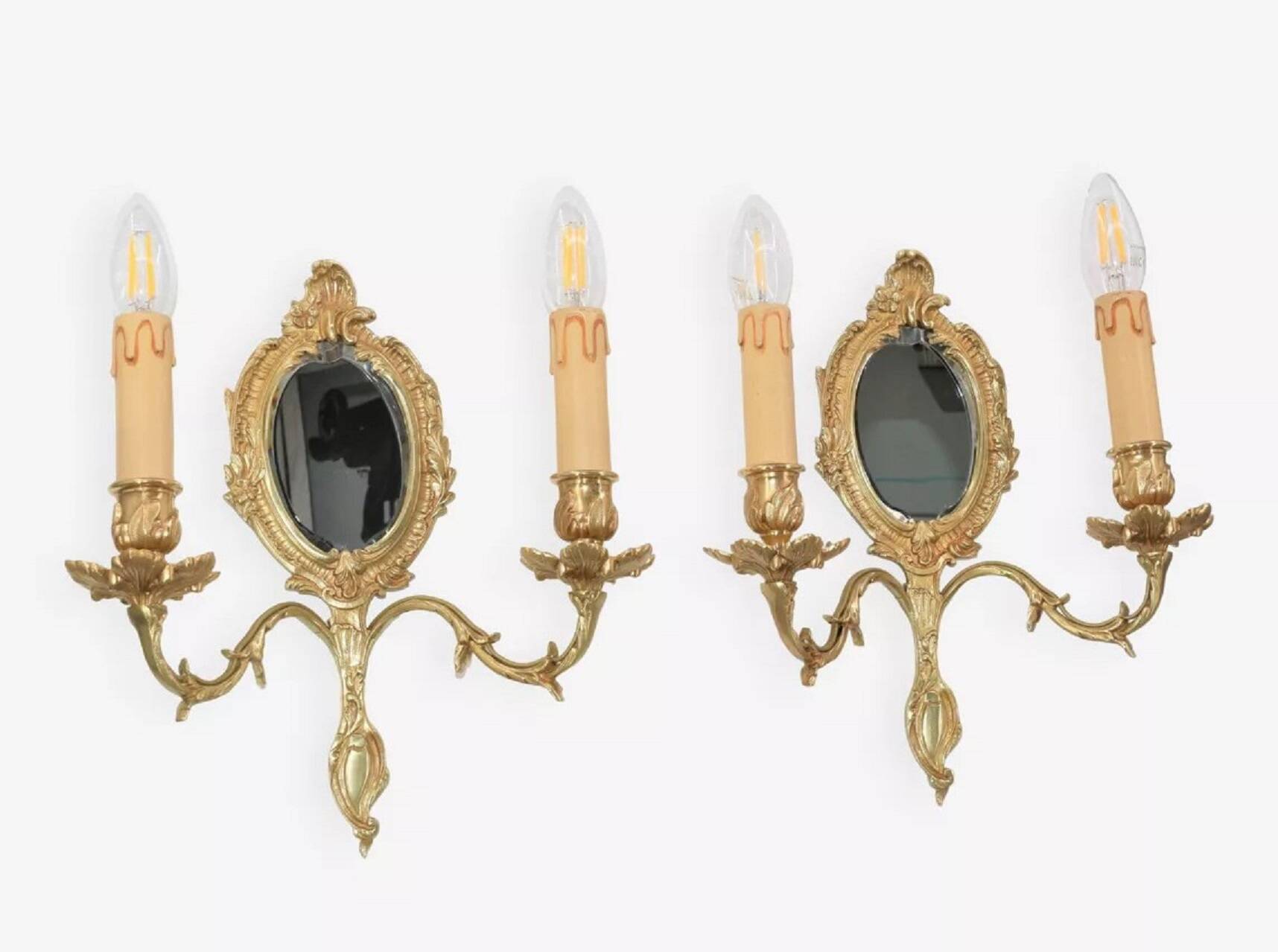 Pair of Louis XV style beveled mirror sconces in bronze by Lucien Gau