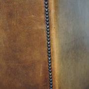 Stately, sleekly finished, comfortable sheepskin armchair