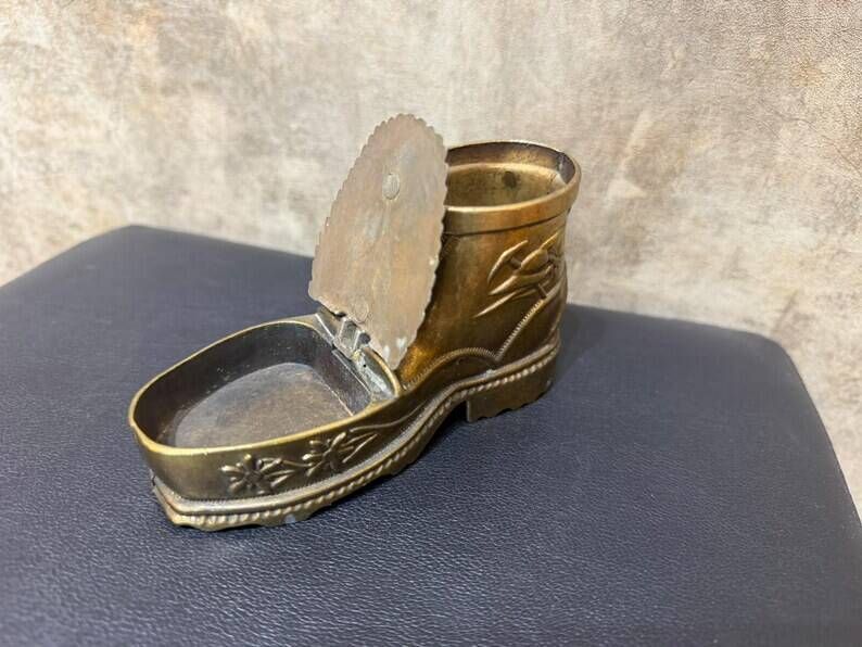 Vintage ashtray in the shape of a hiking boot with a hinged lid