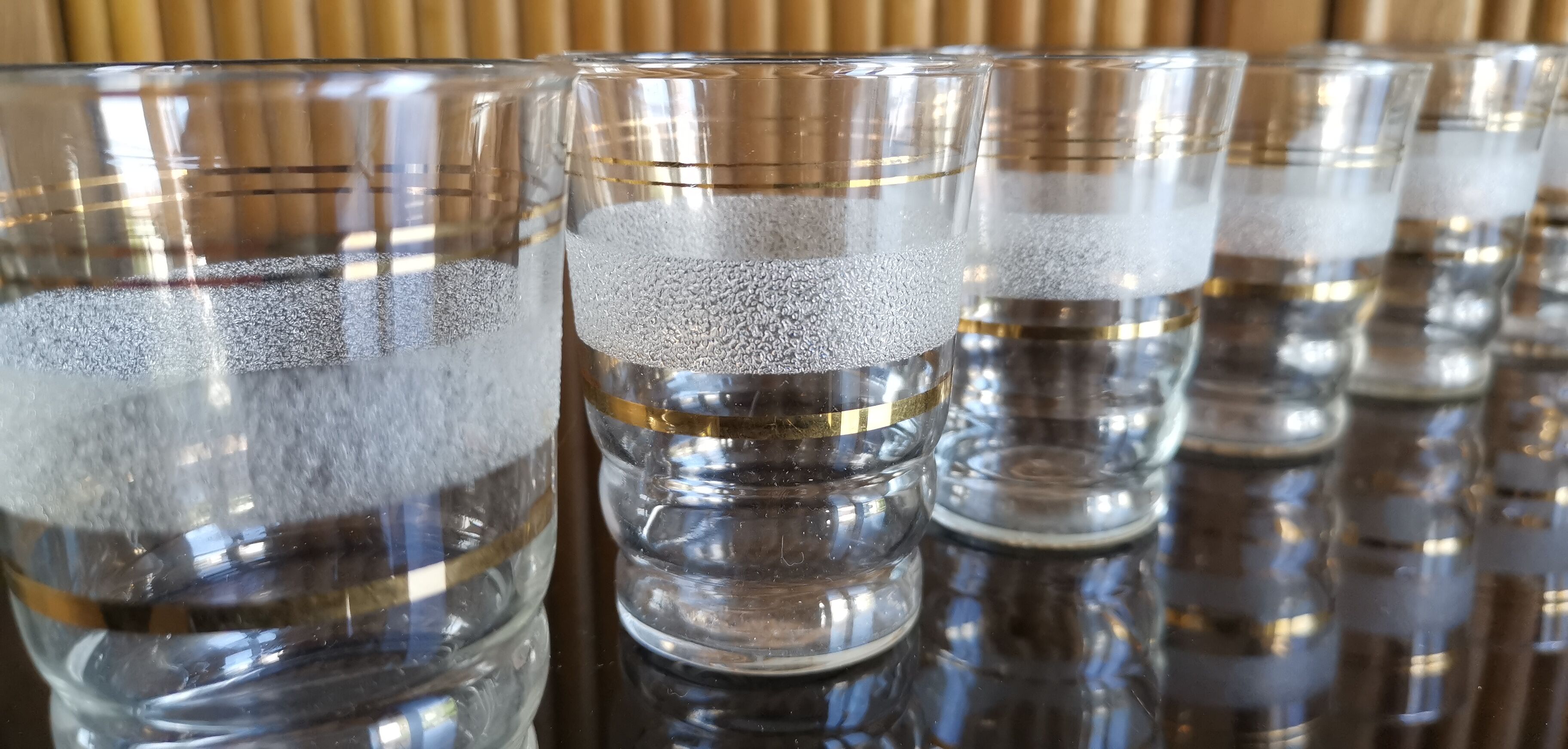 8 granite glasses bordered gold 1950s