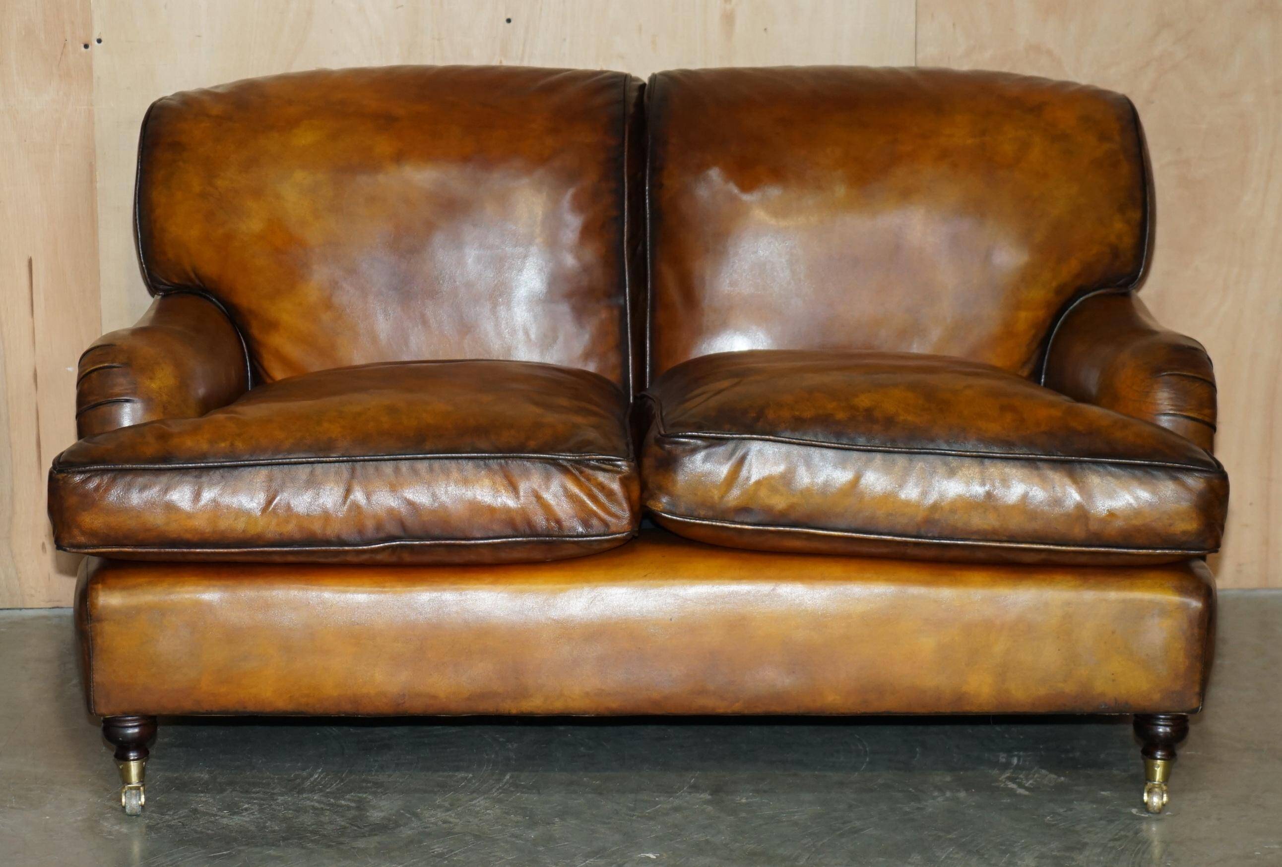 Howard & Son restored leather canapé, width 145 cm
