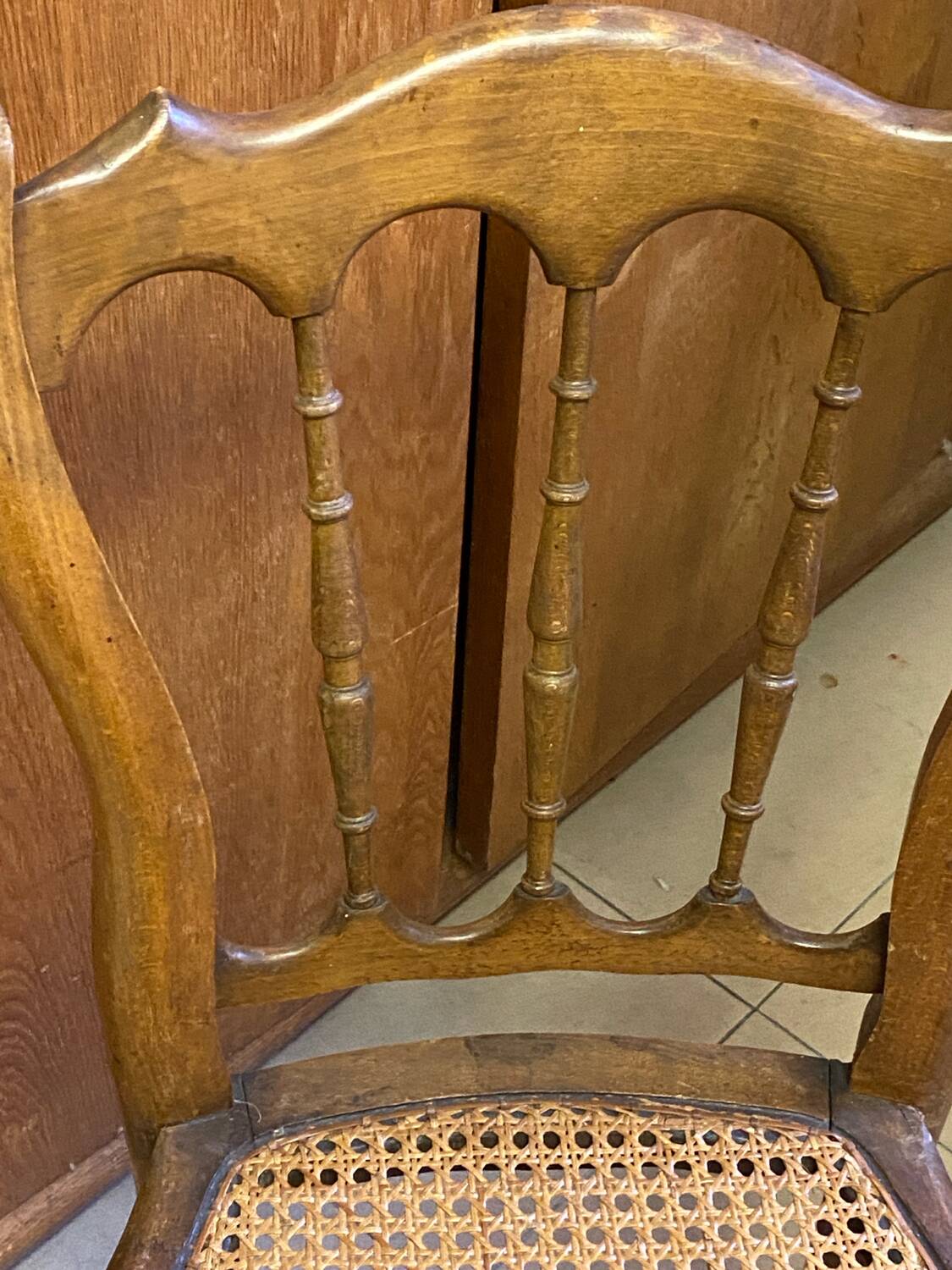 Antique wooden chair, cane seat