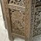Ancient oriental pedestal table in carved wood