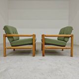 Pair of chalet style armchairs in green fabric