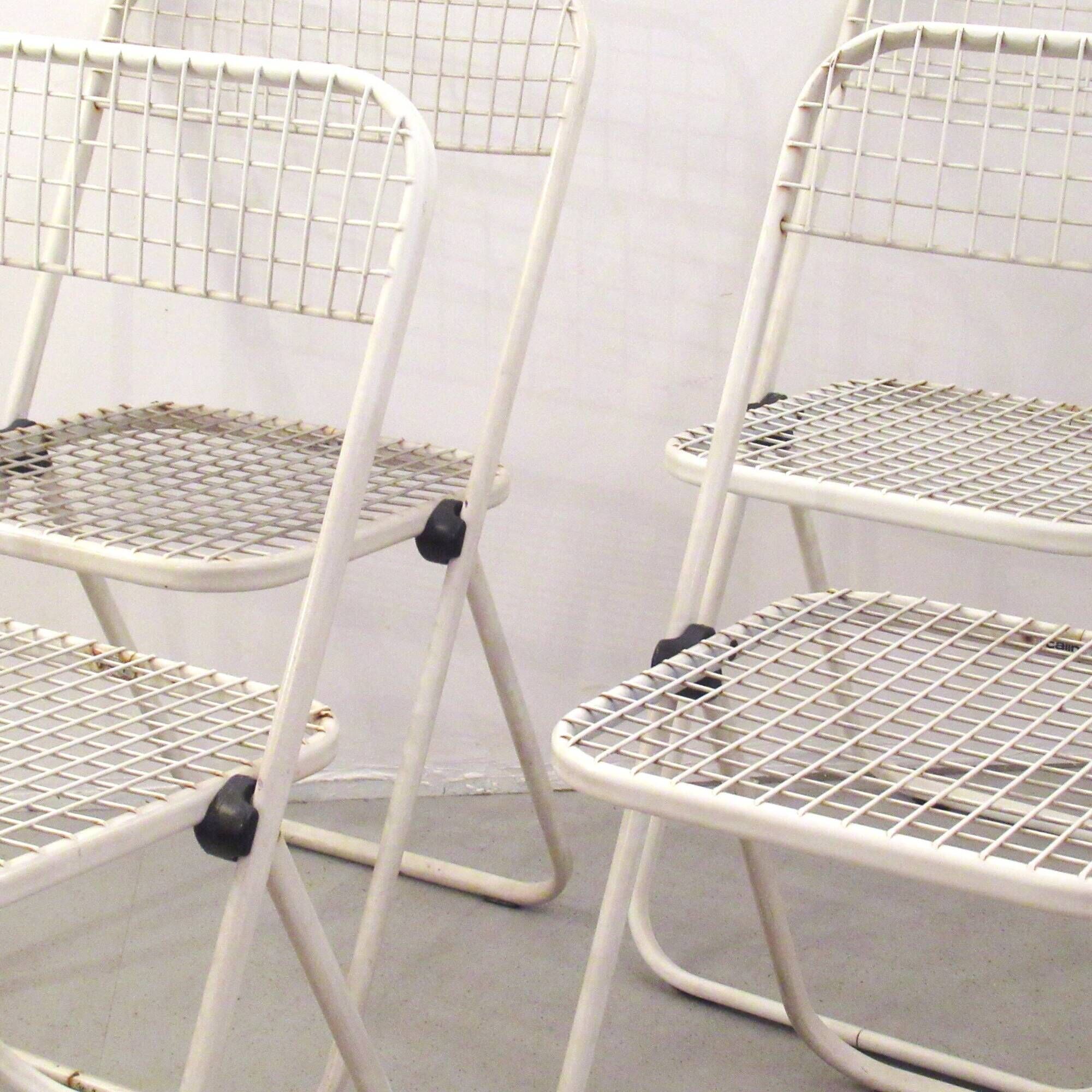Four Talin Spa metal mesh chairs from the 1980s.