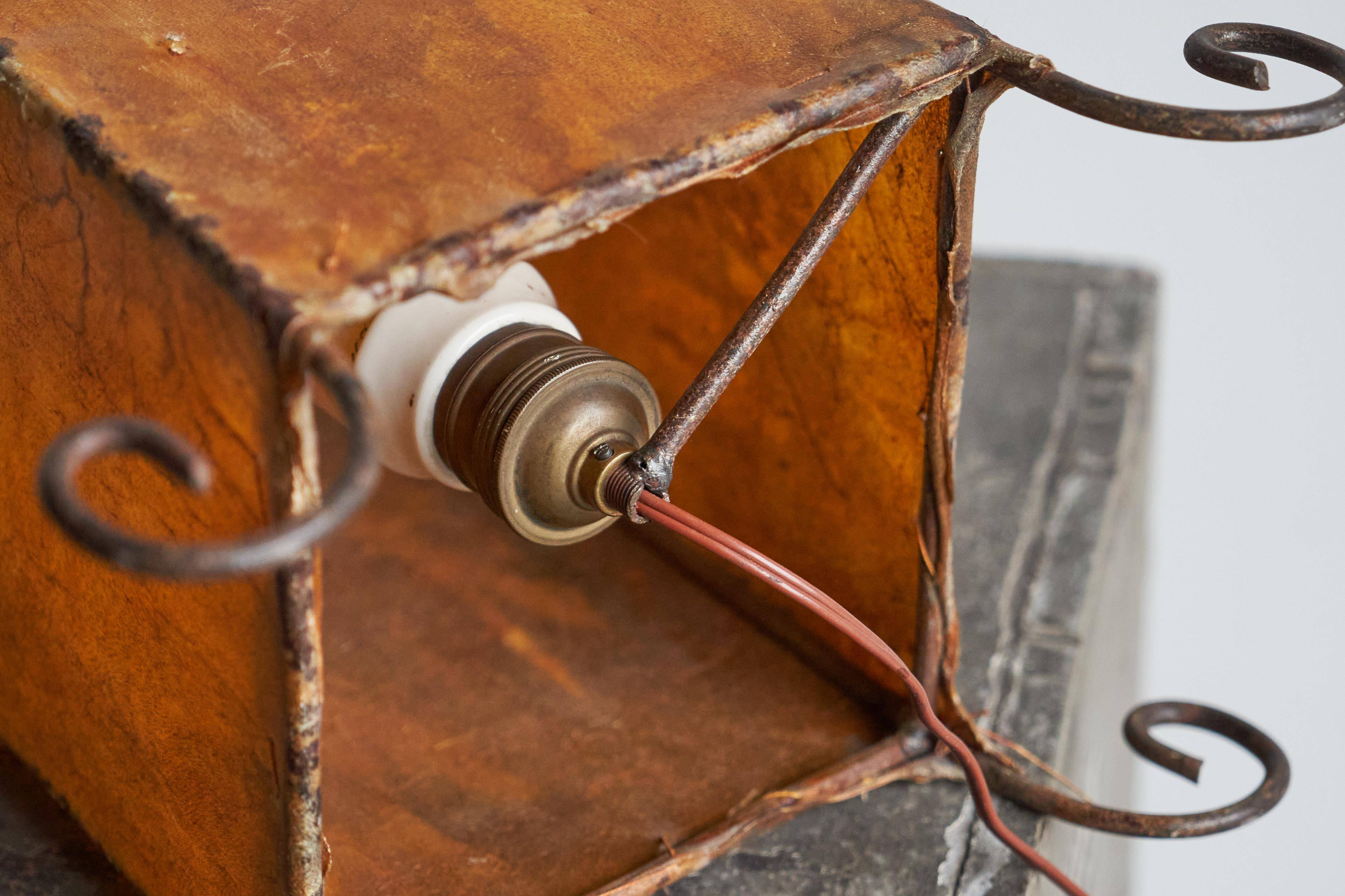 Mid-century table lamp in goat leather and wrought iron, 1950s