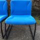 Electric blue fabric designer armchairs with black lacquered metal legs from the 80s.